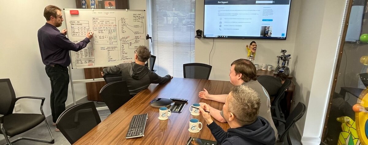 Small business IT support consultation discussing costs, service scope and monthly support options
