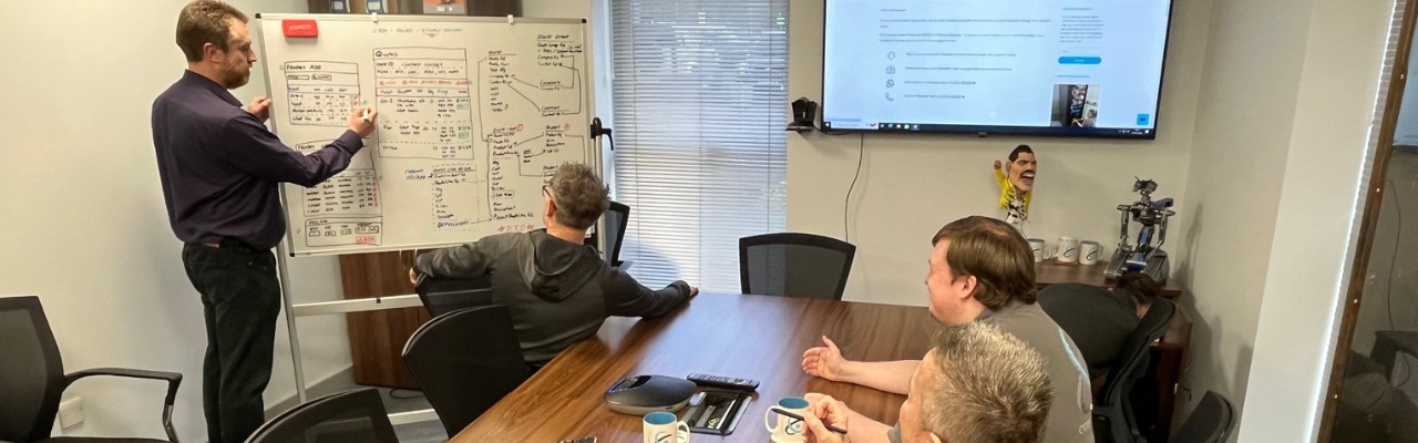 Computercentric IT support team meeting in Wolverhampton discussing managed IT services